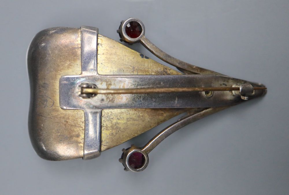 A Scandinavian? parcel gilt white metal, enamel and garnet set stylised leaf brooch, 56mm, gross 27.8 grams.